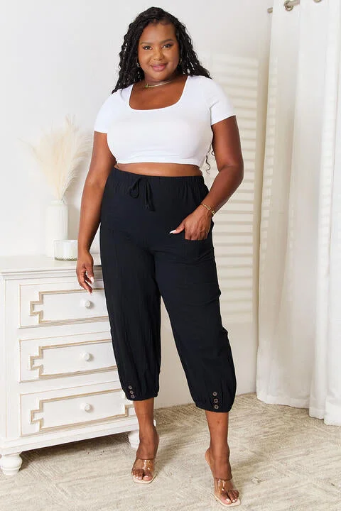 Tapered ankle pants for sleek modern silhouettes -Double Take Decorative Button Cropped Pants