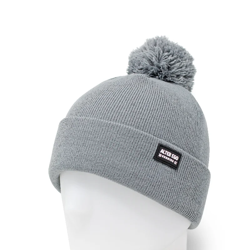 Wool sports cap for chilly game nights -Snowbird Beanie With Pom